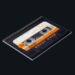 Orange Retro Audiotape 70th birthday Guest Book Notizblock<br><div class="desc">Old Audio Kassette to personalize with your name and date. Design on spiral notebook with text for 70th Birthday party guest book in horizontal guidance. You can easily change text (machen, mitbewohner, size and position) by clicking the customize button. In hard cover guest book. Matching birthday save the date postcard...</div>