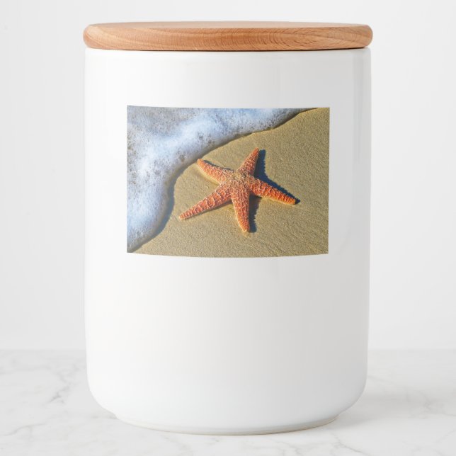 Orange Starfish am Strand Lebensmitteletikett (Vorderseite)