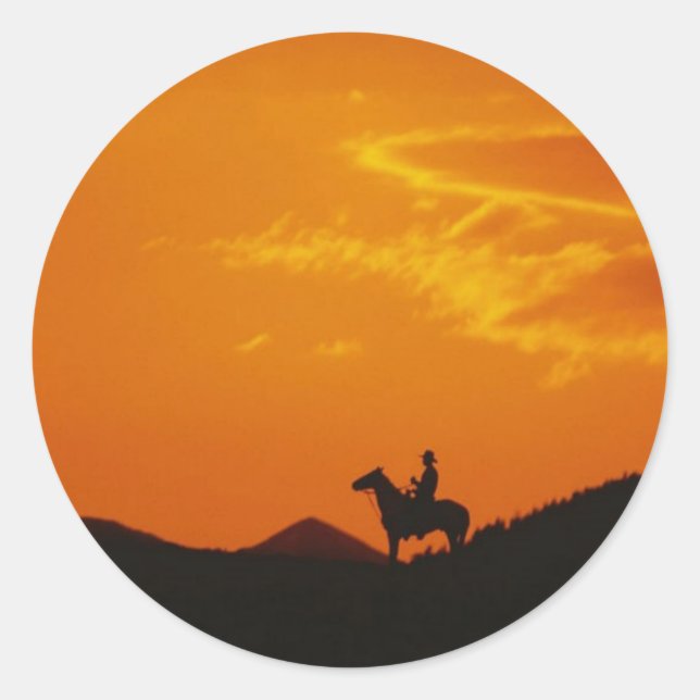Orange Sunset mit Cowboy-Silhouette Runder Aufkleber (Vorderseite)