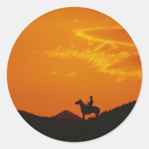 Orange Sunset mit Cowboy-Silhouette Runder Aufkleber