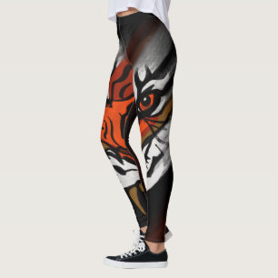 ORANGE- UND SCHWARZE STREIFEN LEGGINGS