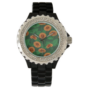 Orange Zinnia Blume, grüne Blätter auf dunkelgrün Armbanduhr