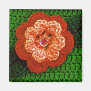 Orangefarbene Blume mit Crochet aus grünem Leaf Magnet