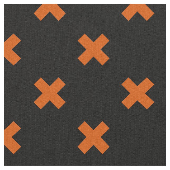 Orangefarbene Kreuzstiche auf schwarz Stoff (Nahaufnahme)