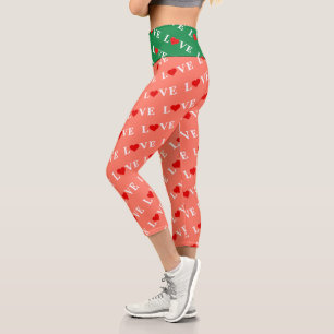 Orangefarbene LIEBE und rotes Herzdesign Elegante Capri Leggings