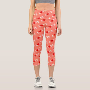 Orangefarbene LIEBE und rotes Herzdesign Elegante Capri Leggings