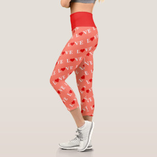 Orangefarbene LIEBE und rotes Herzdesign Elegante Capri Leggings