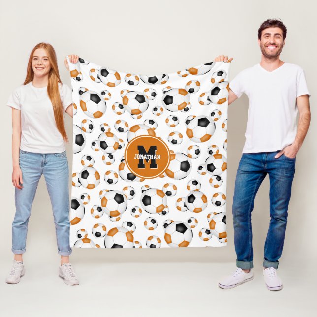 Orangefarbene schwarze Mannschaft Farben Jungs Fuß Fleecedecke (Beispiel)