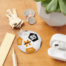 Orangefarbene schwarze Mannschaft Farben Jungs Mäd