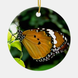 Orangefarbene, schwarze und weiße Schmetterlinge a Keramikornament