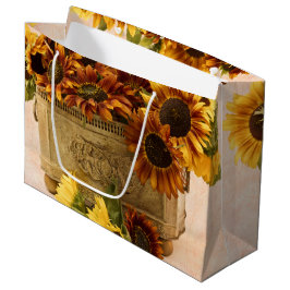 Orangefarbene Sonnenblumen im Körbchen Große Geschenktüte