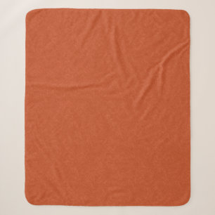 Orangefarbene texturierte Oberfläche mit wirbelnde Sherpadecke
