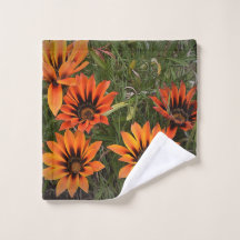 Orangefarbene und schwarze Gazanias-Gesichtshandtü