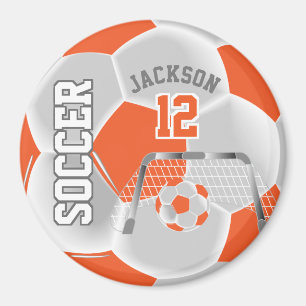 Orangefarbener und weißer Fußballball Magnet