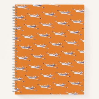 Orangefarbenes Flugzeugnotebook, Beechcraft Bonanz Notizbuch