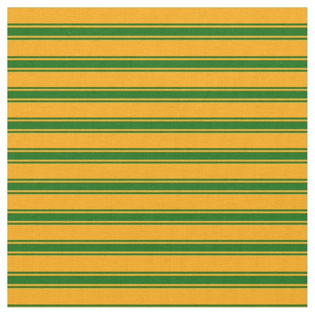 Orangefarbenes und dunkelgrünes Muster Stoff (Nahaufnahme)