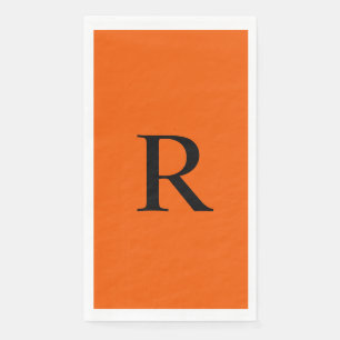 Orangefarbenes und schwarzes Monogramm-Papierhandt Serviette