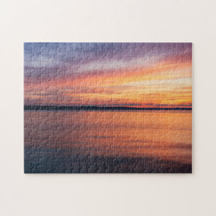 Orangene und violette Sonnenuntergangswolken über  Puzzle