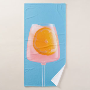 Orangensaft in klarem Trinkglas Badehandtuch