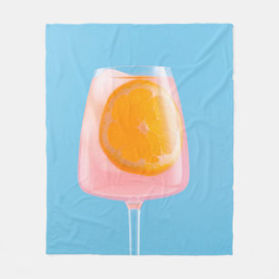 Orangensaft in klarem Trinkglas Fleecedecke