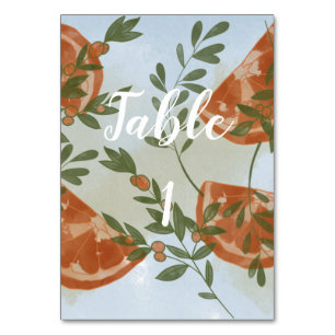 Orangenzitrus und Grünpflanzen Tischnummer