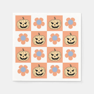 Oranger Halloween-Kürbis und Schachbrettmuster mit Serviette