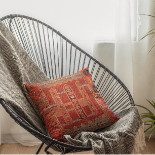 Orientalisches Teppichdesign in hellen Orangen Kissen