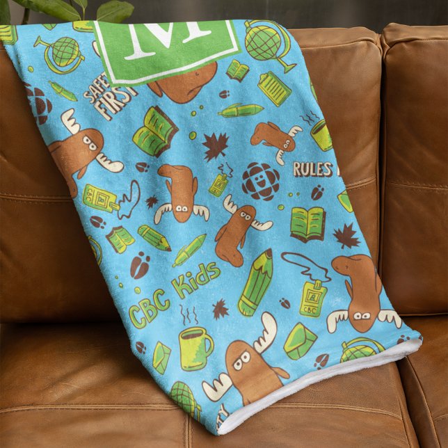 Orlando Pattern Monogram Fleecedecke (Blanket folded over couch)