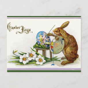 Osterhase beim Bemalen eines Ostereis in künstleri Postkarte
