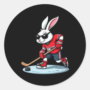 Osterhase spielt Hockey Runder Aufkleber