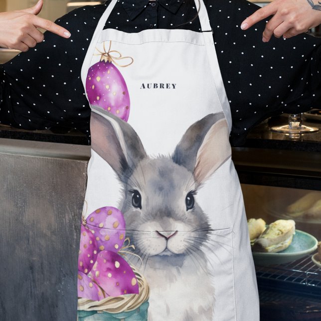 Osterhase und Getreideeier im Korb Schürze (Bunny and cerise and electric purple Easter eggs on a chef's apron for Easter crafts and cooking. )