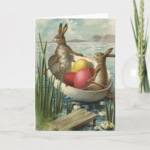 Osterhasen im Vintage-Stil in einem Boot mit Oster Feiertagskarte