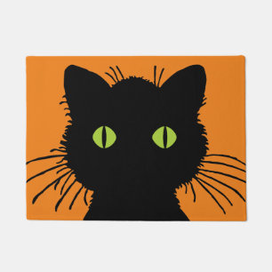 Oversifizierte schwarze Katze mit grünen Wucheln Fußmatte