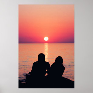 Paar auf See bei Sonnenuntergang Poster