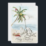Palm Tree & Beach Stühle Tropical Holiday Card Einladung<br><div class="desc">Diese Weihnachtskarte "Frohe Weihnachten von dieser Seite der Welt" zeigt eine Palme mit Ornamenten und Lichtern,  ein Paar Liegestühle unter dem Regenschirm auf einem Sandstrand in Aquarell. Auf der Rückseite stehen Palmen und das Meer in Aquarelltönen. Personalisieren Sie es für Ihre Bedürfnisse. In meinem Geschäft finden Sie passende Produkte.</div>