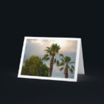 Palmen im Sonnenschirm Karte<br><div class="desc">Palmen in Sunny Sky Portrait Grußkarte. Sie können dieses Produkt ganz einfach kostenlos anpassen, wenn Sie Text hinzufügen oder die Farbe des Hintergrunds ändern möchten.</div>