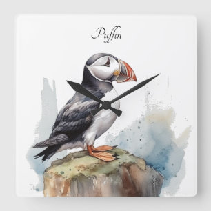 Papageientaucher auf einem Felsen Aquarell, indivi Quadratische Wanduhr