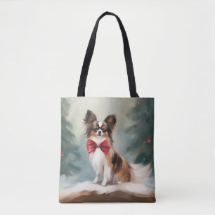Papillon-Hund im Schnee Weihnachten 