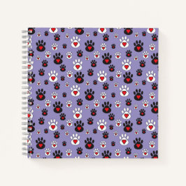 Paw Prints mit roten Herzen auf blau Notizbuch