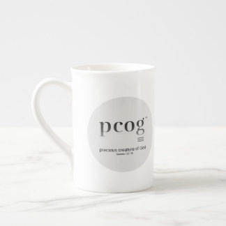 pcog Akronym; runde Vollnachricht; schwarz-weiße F Prozellantasse