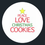 Peace Liebe Weihnachtskekse Runder Aufkleber<br><div class="desc">Liebe und Weihnachtskekse. Herzlichen Glückwunsch für Sie und Ihren Urlaub. Lass das Fest an.</div>