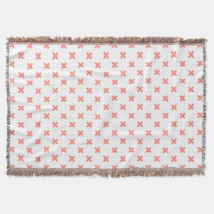 Peach cross stitches auf weiß decke