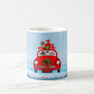 Pekingese Hund in Auto mit dem Weihnachtsmann Kaffeetasse
