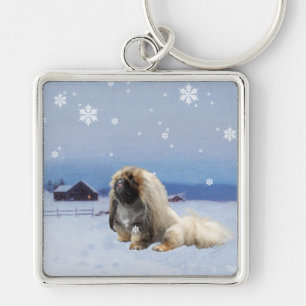 Pekingese im Winter Schlüsselanhänger