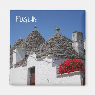 Pelargonie-Blumen und trulli Häuser in Alberobell Magnet