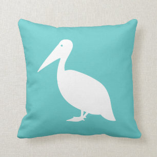 PELICAN auf aquamarinem blauem Kissen