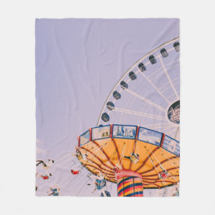 People riding on yoyo ride at daytime fleecedecke