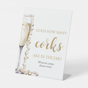 Perlen und Prosecco schätzen, wie viele Corks Spie Sockelschild