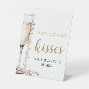 Perlen und Prosecco schätzen, wie viele Kisses Gam Sockelschild