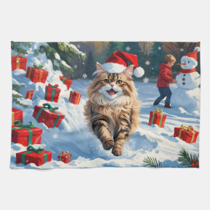 Perserkatze sitzt im Schnee mit Weihnachtsmütze Geschirrtuch